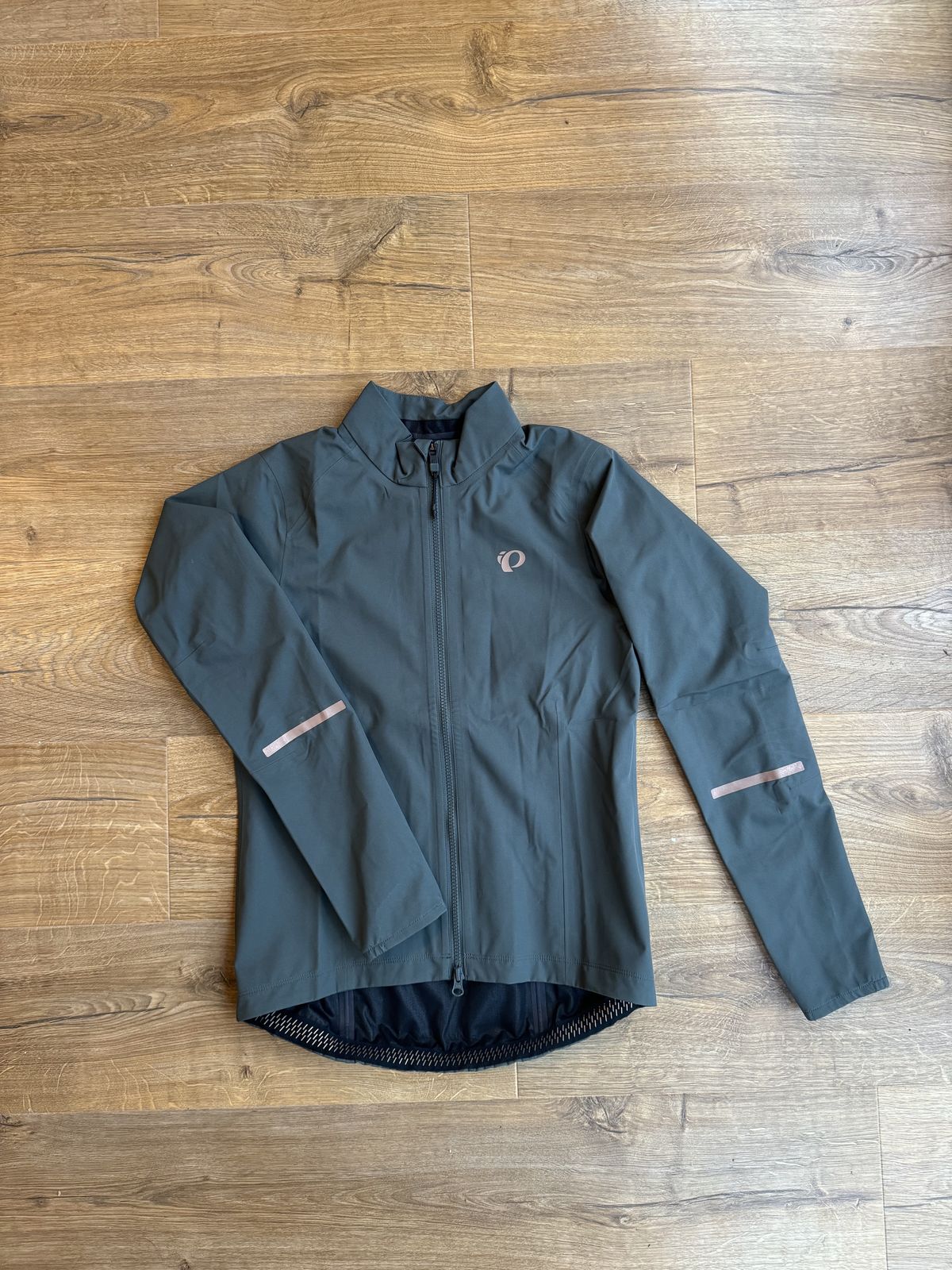 Jacket flatlay, showing off the reflective details and sleeves