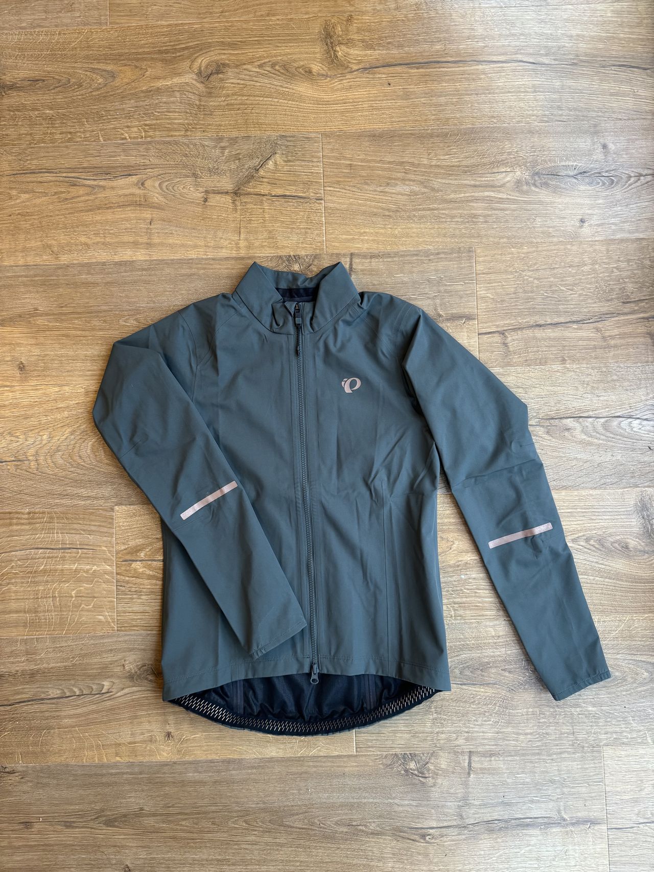 Jacket flatlay, showing off the reflective details and sleeves