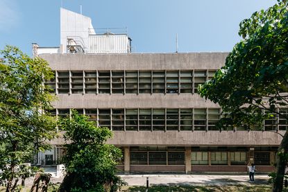 Elisabeth Luce Moore Library, CUHK as part of Hong Kong brutalism map, concrete facade three levels and blue skies