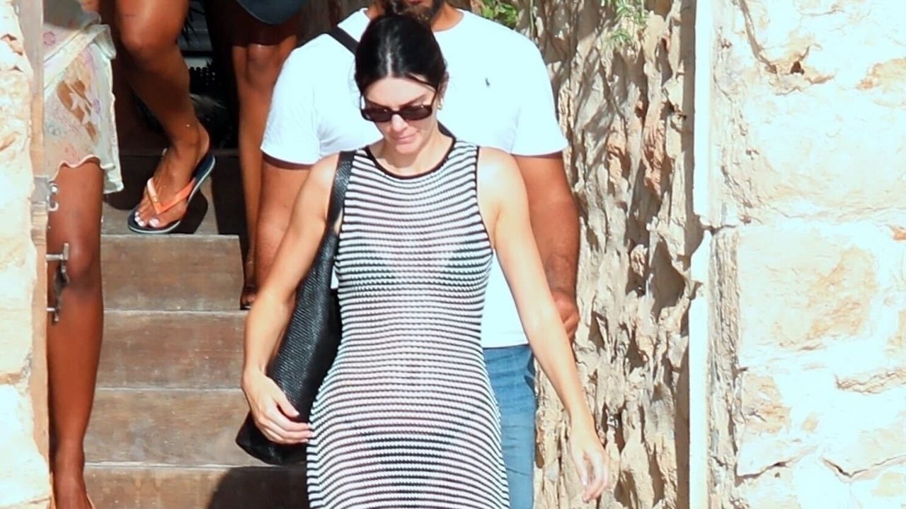 Kendall Jenner wearing a sheer DISSH dress with The Row flip flops in Ibiza August 2024