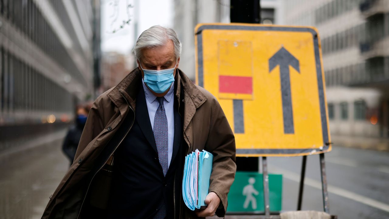 Michel Barnier walks to a conference centre in central London