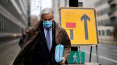 Michel Barnier walks to a conference centre in central London