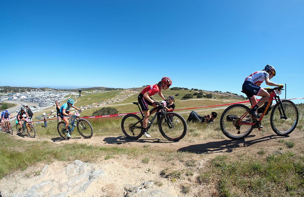 Kate Courtney (Specialized) leading teammate Annika Langvad and several others up the longest climb.