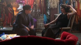 Alex and Midge sitting in a costume room in The Marvelous Mrs. Maisel season 5 