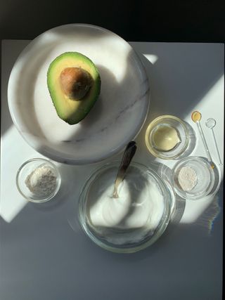 guy morgan's avocado face mask ingredients including avocado and yogurt in white bowls