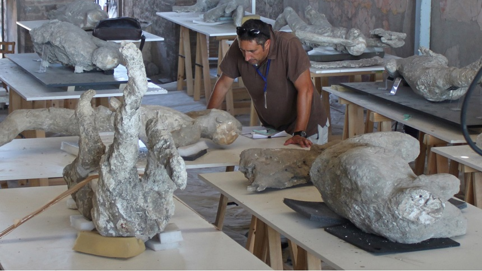 Archeologist Lloren&ccedil; Alapont among some of the plaster casts of the victims at Pompeii.