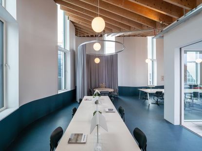 Large meeting room table with chairs