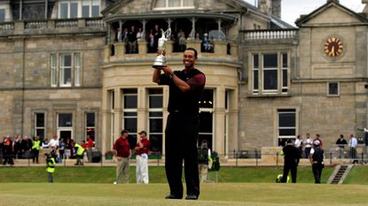 Tiger Woods holds the Claret Jug on the 18th green at St Andrews