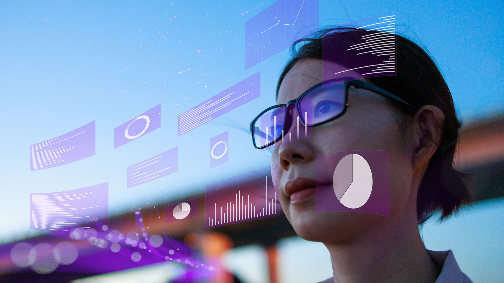 A close-up shot of a female data engineer with holographic data readouts in front of her face.