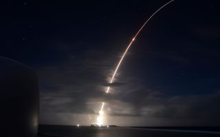 A threat-representative ICBM target launches from the Ronald Reagan Ballistic Missile Defense Test Site on Kwajalein Atoll in the Republic of the Marshall Islands March 25, 2019 in this long-exposure photo. It was successfully intercepted by two ground-based interceptor missiles launched from California.