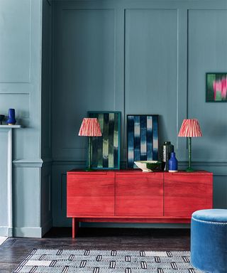 Paneling ideas for walls with blue panelled dining room with red sideboar