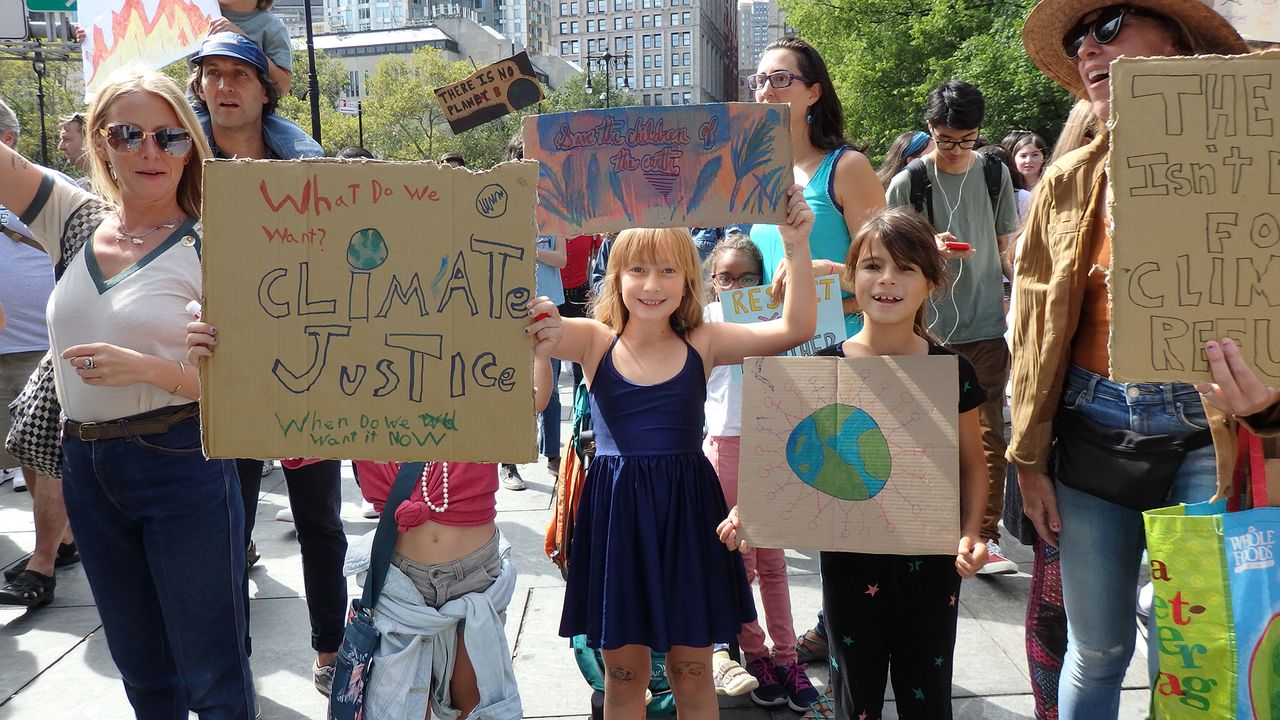 Students in New York City hold signs at the Global Climate Strike on Sept. 20.