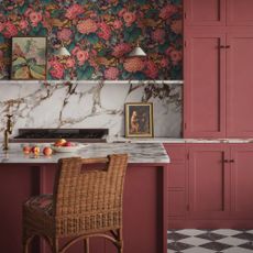 Red kitchen cabinets with floral wallpaper