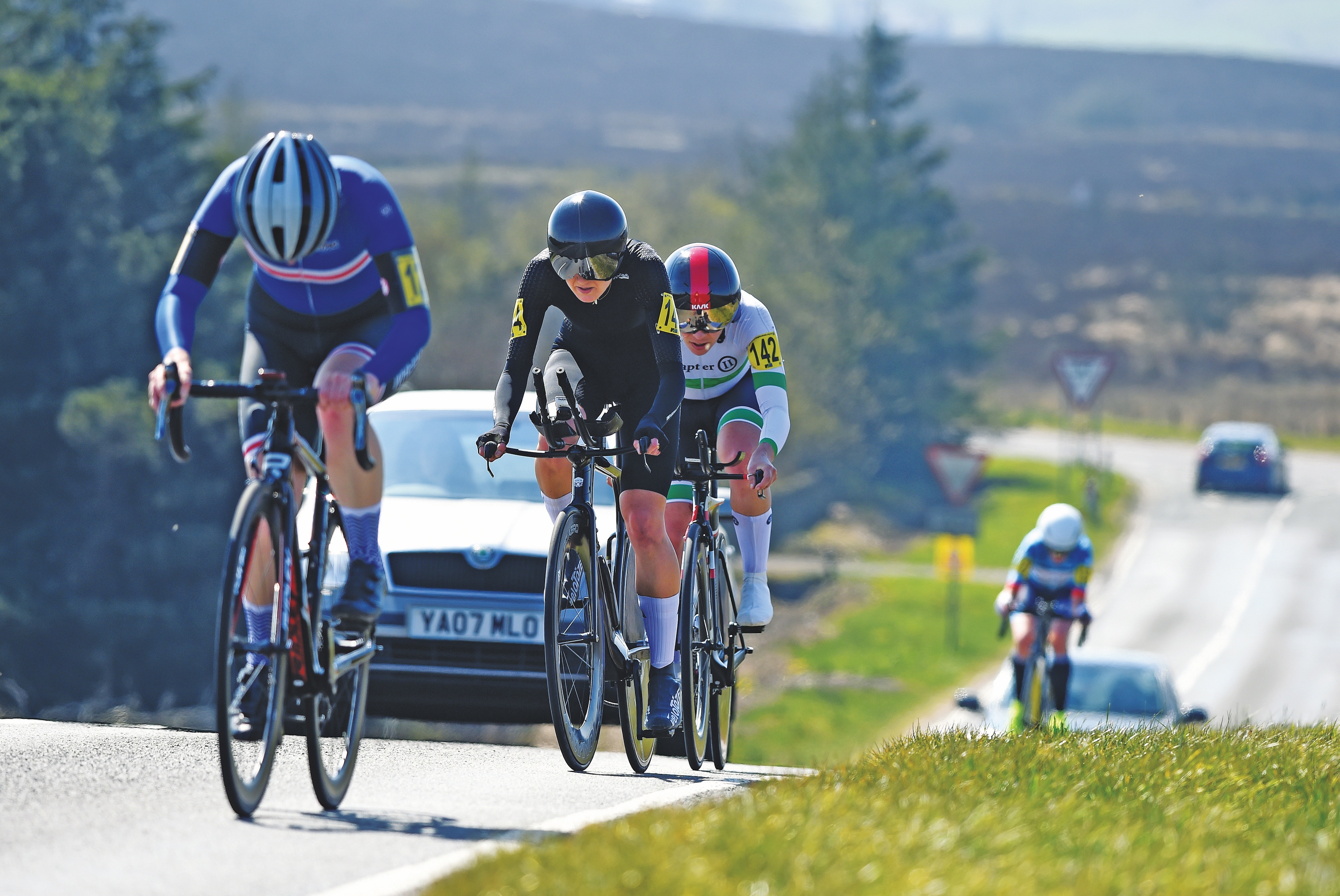 UK Time triallists climbing a hill