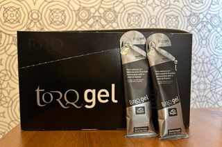 Two Torq Performance Energy Gels Naked resting against its packaging