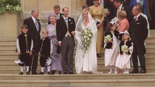 Prince Edward and Duchess Sophie surrounded by their families outside St. George's Chapel on their wedding day in 1999