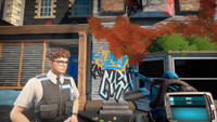 A police officer with curly hair on a sleepy town street