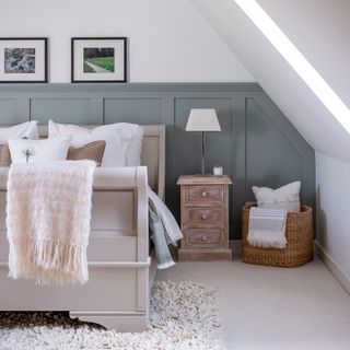 bedroom with neutral colored bed and flooring