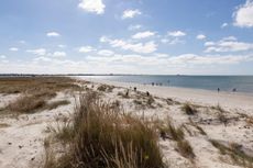 The remote sandy beach at Thorney Island juts into Chichester Harbour in West Sussex.