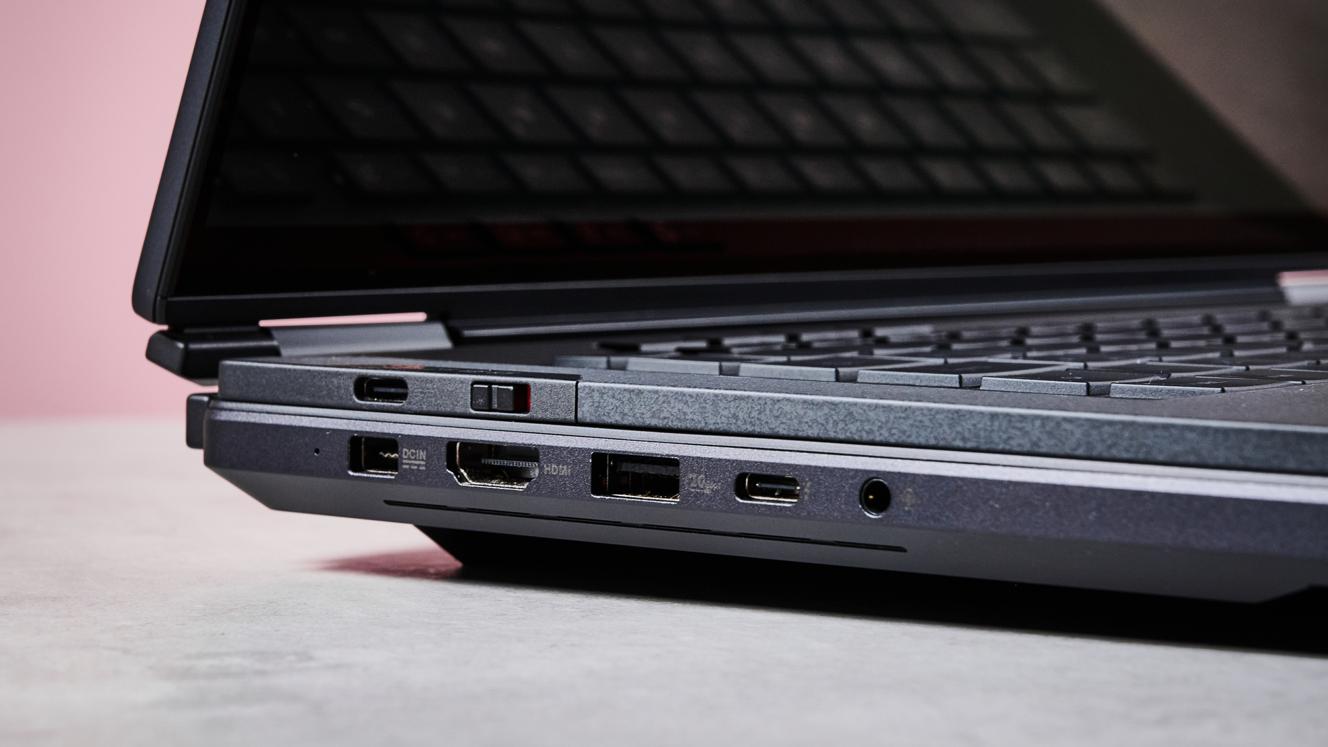Close-up of ports on left-hand side of ASUS ROG Zephyrus Duo 2026 with pink wall in background