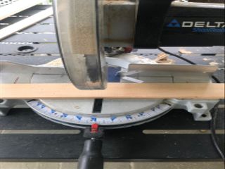Wood trim pieces being cut by a circle saw