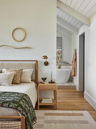 bedroom with beige walls and blue millwork