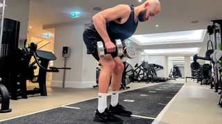 Calum Sharma, personal trainer at the Body Lab, performs the latter position of a bent over row
