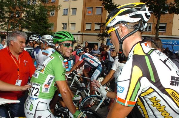 Cavendish is congratulated by his teammates.