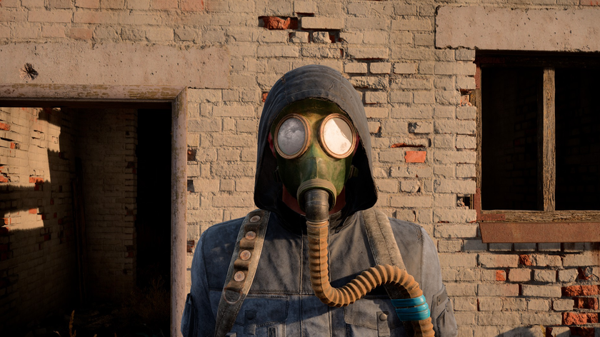 A man in a gas mask and hood