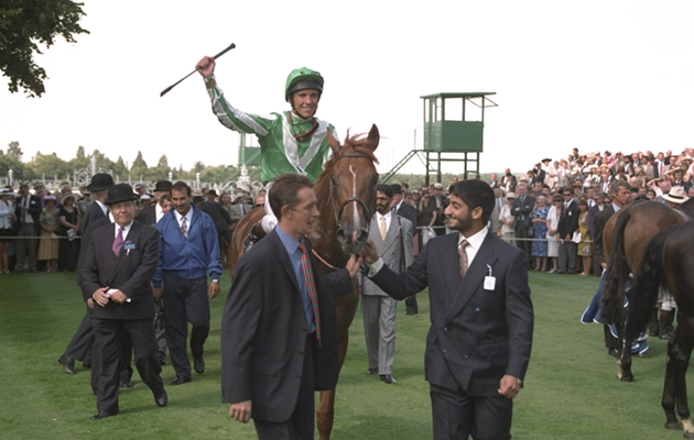 22 Jul 1995: Lanfranco Frankie Dettori of Italy on Lammtarra celebrates after winning the King George and Queen Elizabeth Diamond Stakes at Ascot racecourse, Ascot, England. Mandatory Credit: Allsport /Allsport