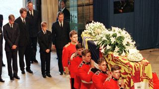 Prince William, Earl Spencer, Prince Harry and Prince Charles follow the coffin of Diana, Princess of Wales, into Westminster Abbey September 6