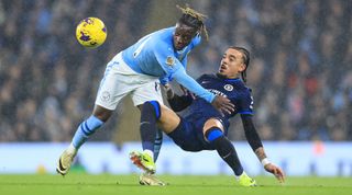 MANCHESTER, ENGLAND - FEBRUARY 17: Jeremy Doku of Manchester City is tackled by Malo Gusto of Chelsea during the Premier League match between Manchester City and Chelsea FC at Etihad Stadium on February 17, 2024 in Manchester, England. (Photo by Simon Stacpoole/Offside/Offside via Getty Images)