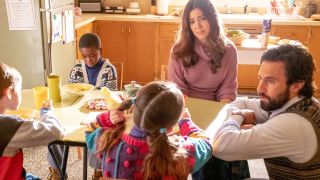Mandy Moore and Milo Ventimiglia sit with kids at the kitchen table in This Is Us.