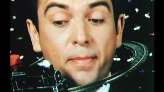 A still from Peter Gabriel&rsquo;s video for So, showing Gabriel with a toy train on a track surrounding his head