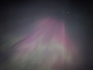A photo of the northern lights in the night sky