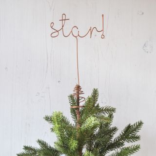 A copper wire 'Star!' Christmas tree topper
