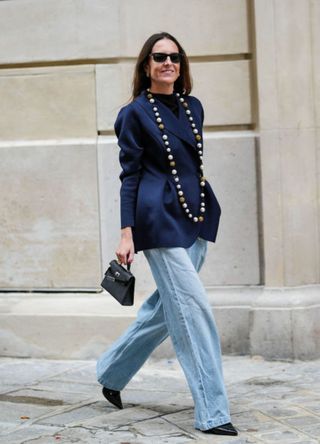 Alba Garavito Torre in a blazer and blue jeans