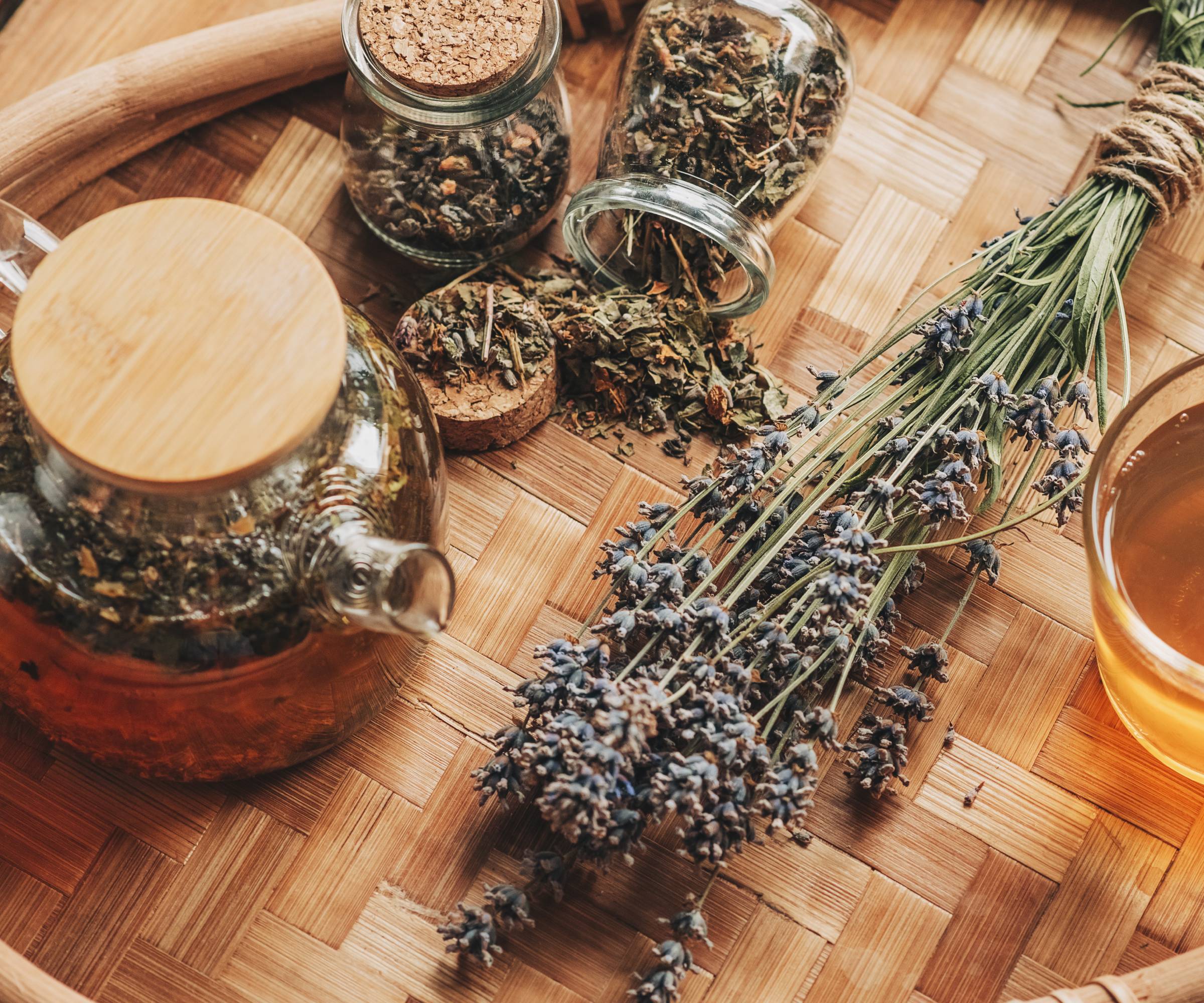 Lavender tea and dried lavender sprigs on a tray