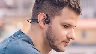 Man wearing Padmate S30 bone conduction headphones