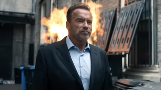 arnold schwarzenegger walking away from a dumpster fire in fubar