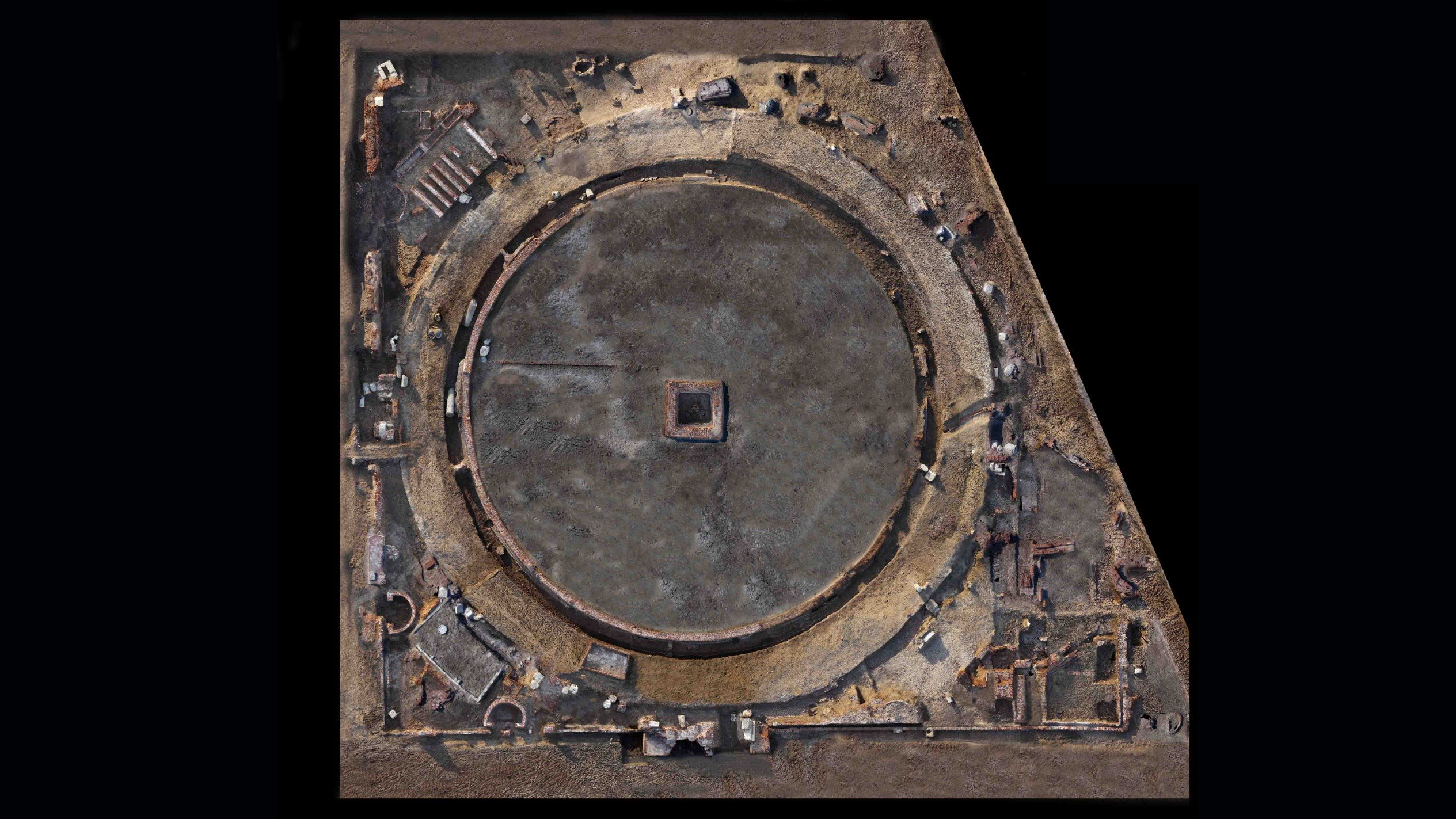 an overhead view of a round brick temple