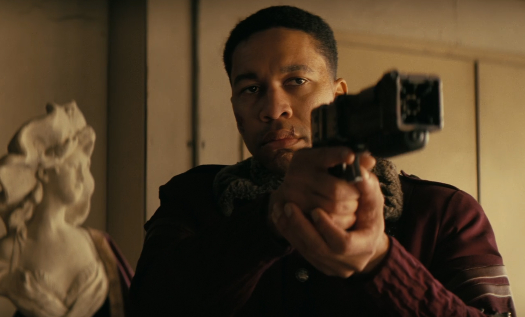 Max from Fallout pointing a pistol