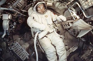 Soyuz 26 flight engineer Georgy Grechko tests an Orlan spacesuit aboard the Salyut 6 space station in December 1977.