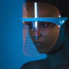 woman wearing a led light therapy face mask
