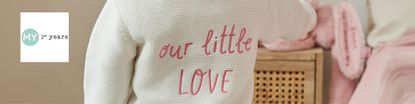 my 1st years logo top left with a close up shot of a jumper that says "our little love"