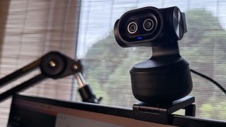 Emeet Pixy Dual-Camera PTZ 4K Webcam on top of a monitor in a 16x9 crop