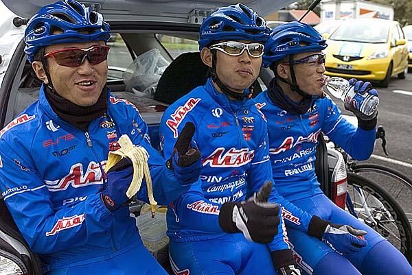Members of the Aisan team relax prior to the start of stage three in Warrnambool.