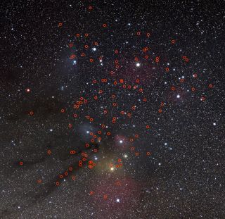This image shows the locations of 115 potential free-floating rogue planets recently discovered by a team of astronomers in the direction of the Upper Scorpius and Ophiuchus constellations, highlighted with red circles. The exact number of rogues found by the team is between 70 and 170, depending on the age assumed for the study region. This image was created assuming an intermediate age, resulting in a number of planet candidates in between the two extremes of the study.