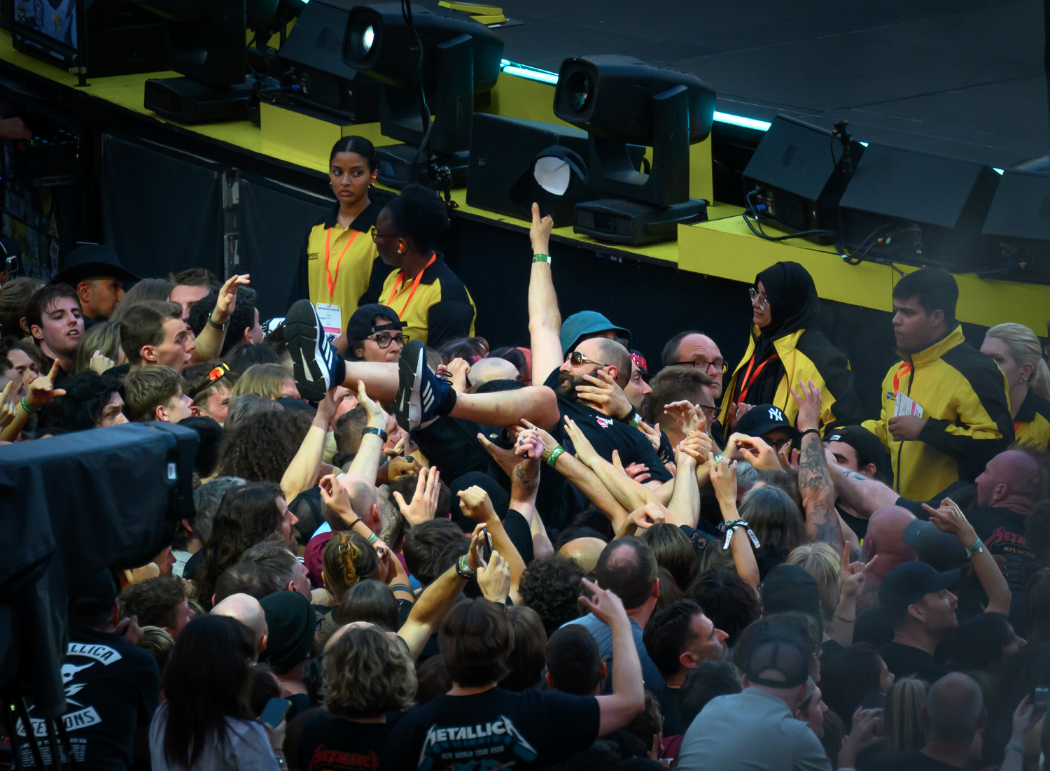 A crowdsurfer at a Metallica show