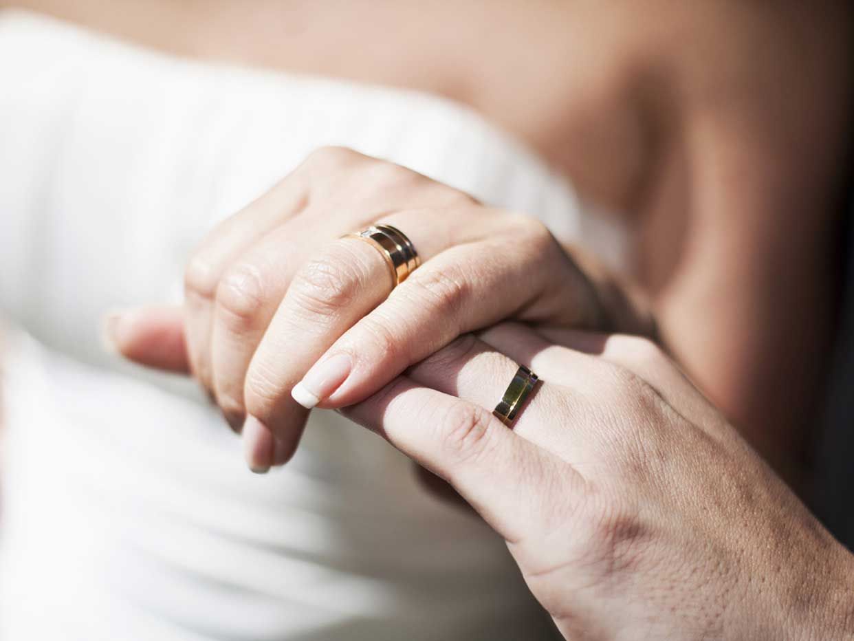 A hand with a wedding ring